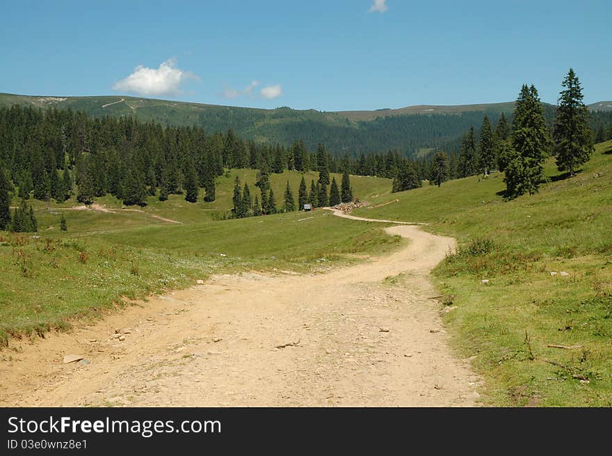 Winding dirt lane ascending a mountain