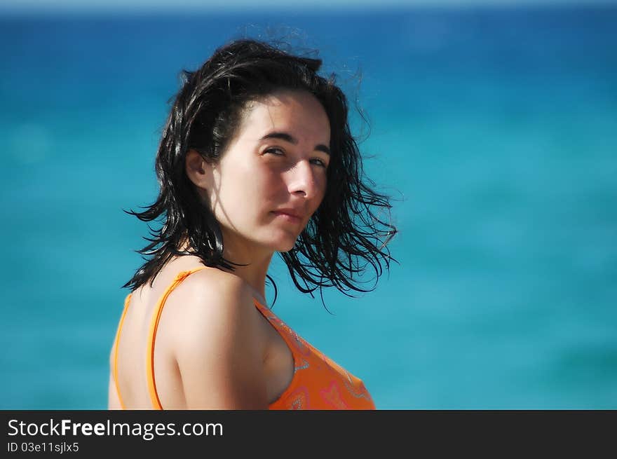 Beautiful girl enjoying the sunshine near the sea. Beautiful girl enjoying the sunshine near the sea