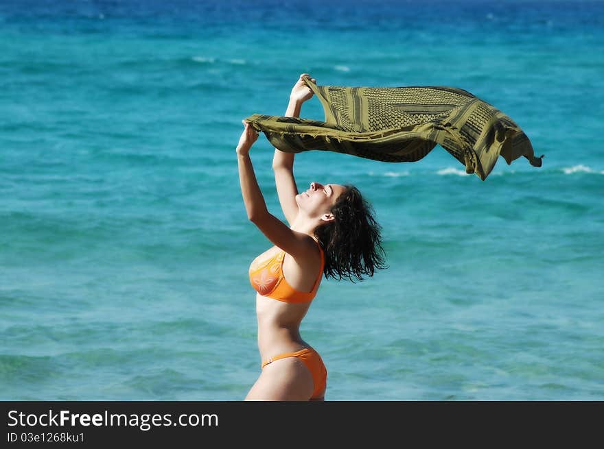 Beautiful young woman on the beach