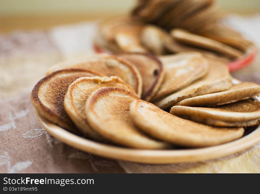 Stack of sweet oat pancakes on ceramic plate. Stack of sweet oat pancakes on ceramic plate