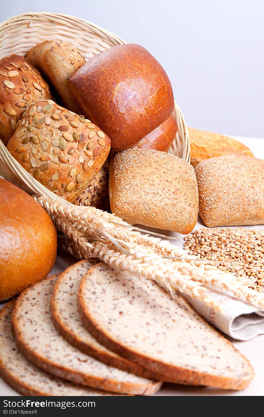 Assortment of baked bread with ears of wheat. Assortment of baked bread with ears of wheat