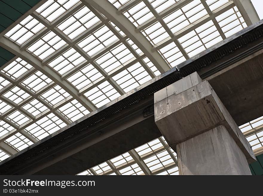 Elevated track of maglev train against the steel and glass ceiling of the maglev station, pudong, shanghai, china. Elevated track of maglev train against the steel and glass ceiling of the maglev station, pudong, shanghai, china