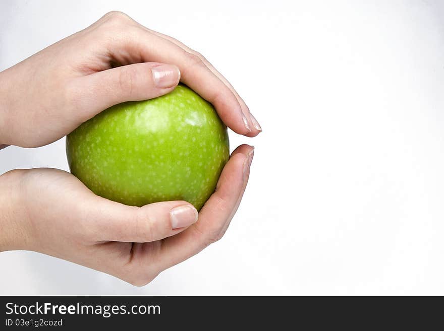 Woman holding healthy green apple in her hands. Woman holding healthy green apple in her hands