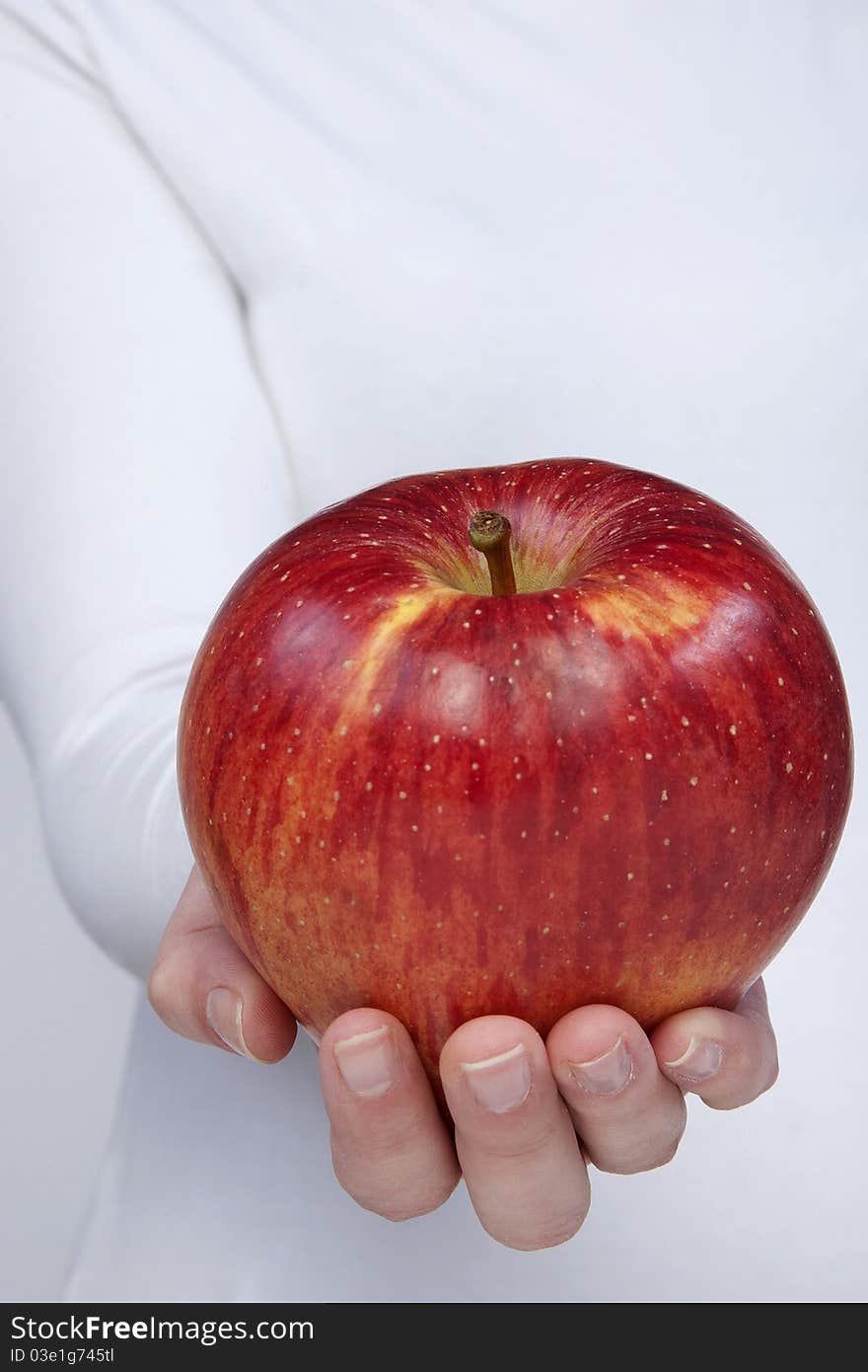 Woman holding red apple