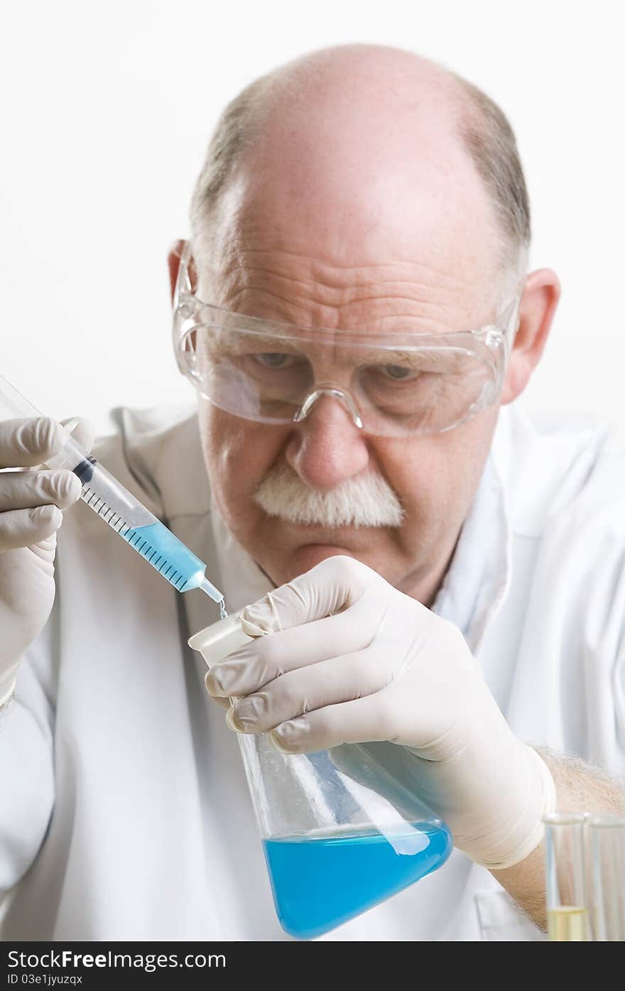 Scientist working with chemicals isolated on white