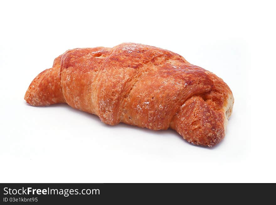 Single fresh croissant, casting soft shadow isolated on white. Single fresh croissant, casting soft shadow isolated on white