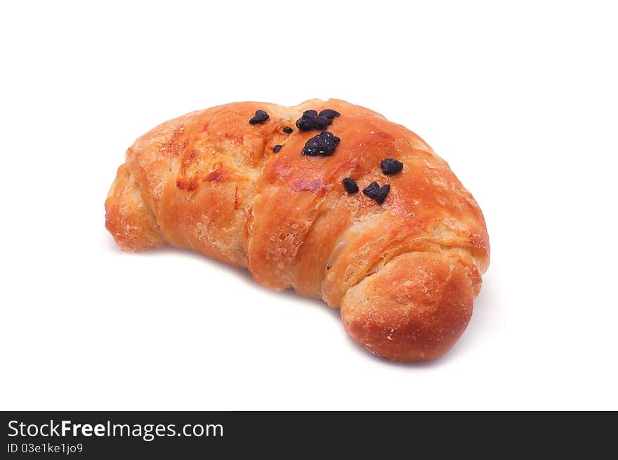 Single fresh croissant, casting soft shadow on white. Single fresh croissant, casting soft shadow on white