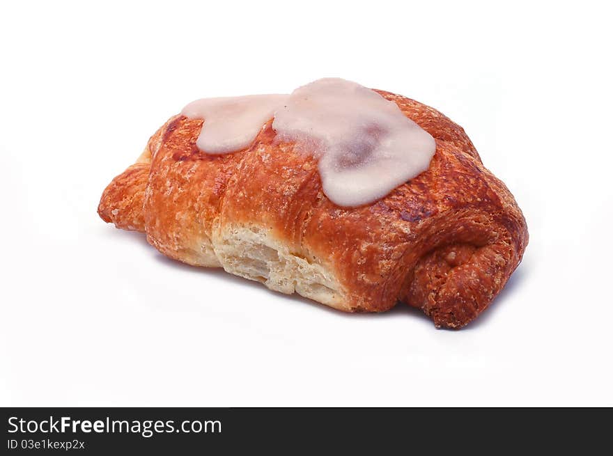 Single fresh croissant on white