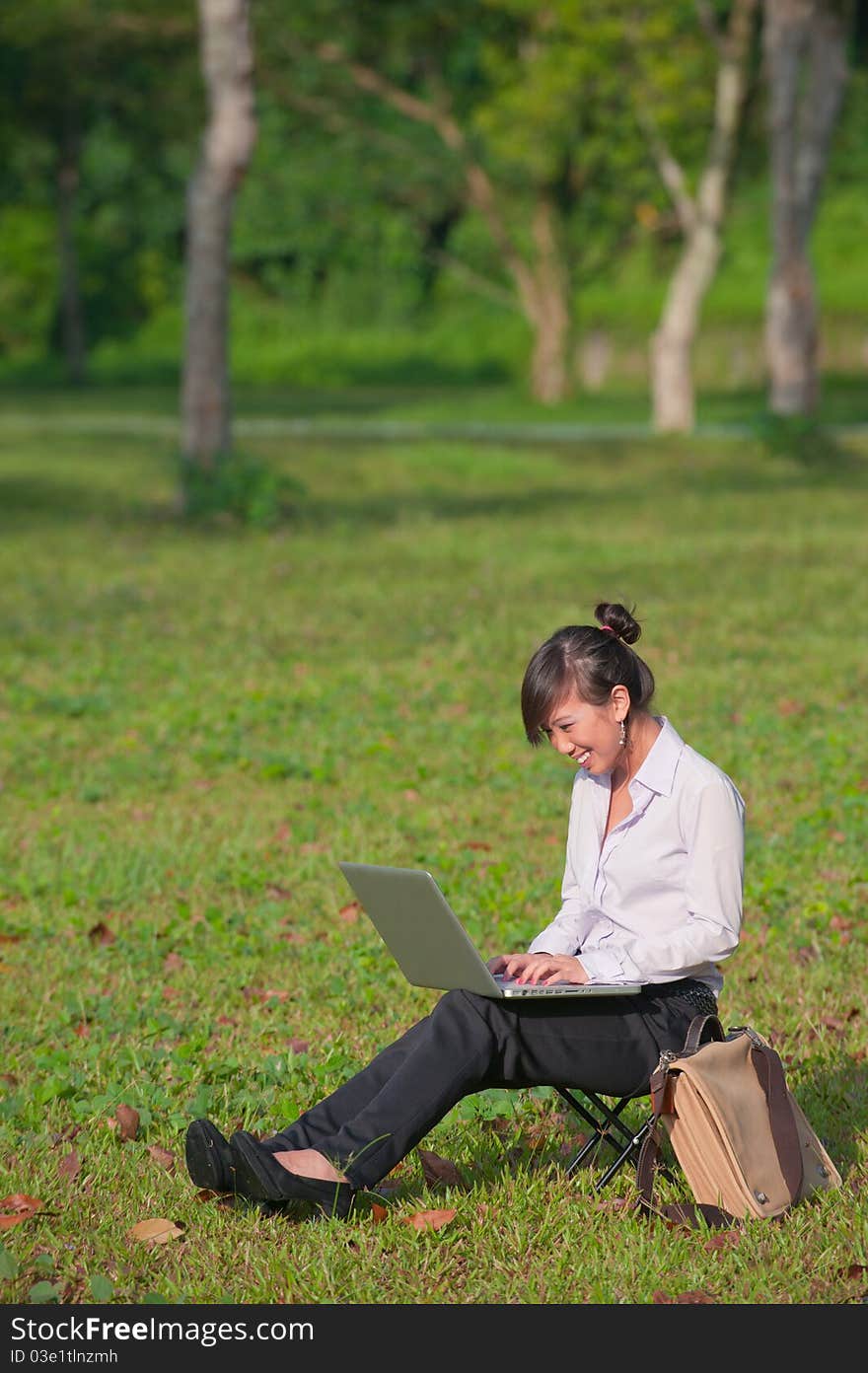 Business Woman Using Laptop Outdoor