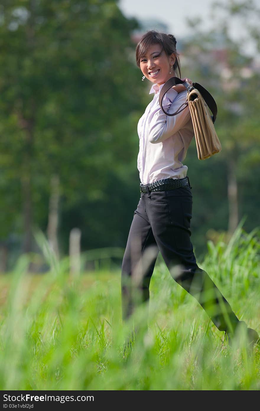 Business woman out in the park. Business woman out in the park