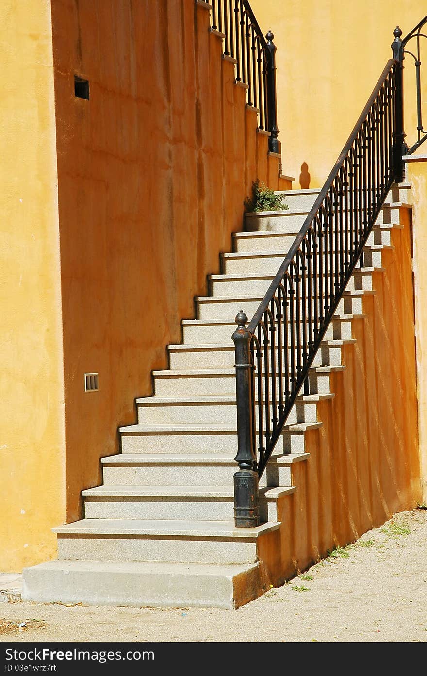 Old stone stairs and yellow walls in Corsica, France