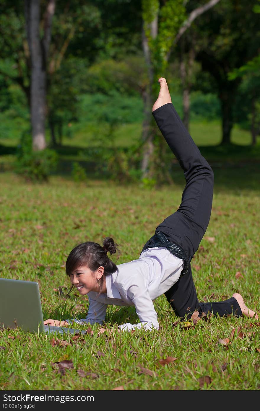 Business woman using laptop outdoor