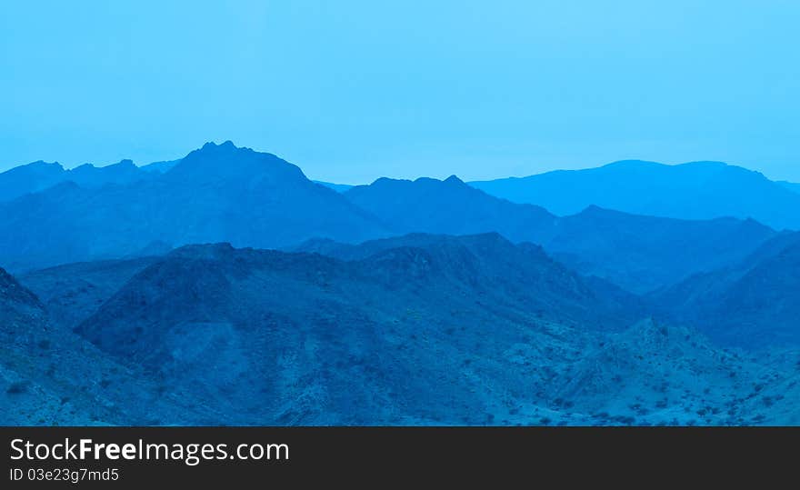 The northern mountain ranges of Oman at twilight. The northern mountain ranges of Oman at twilight