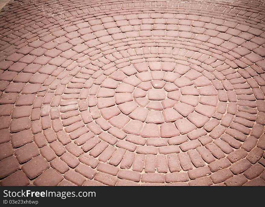 An old pattern of bricks in a walkway. An old pattern of bricks in a walkway.