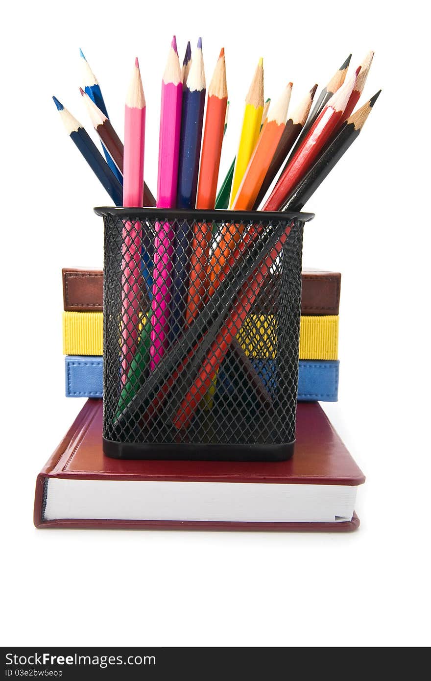 Books and pencils on a white background