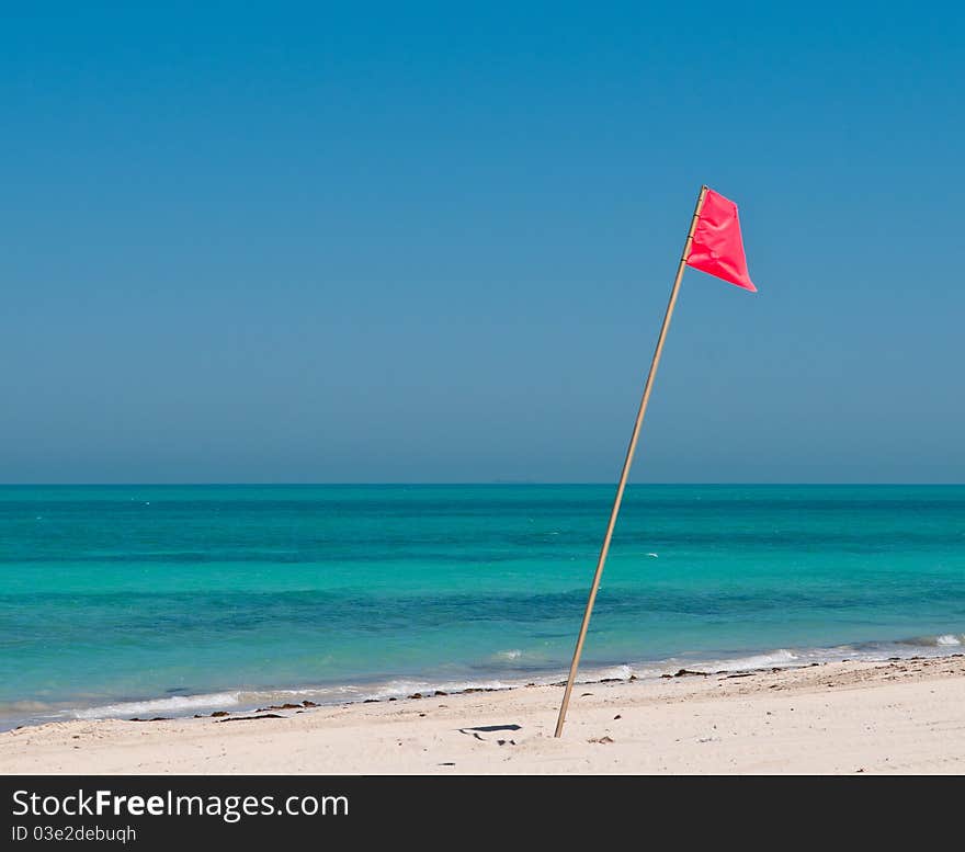 A red flag signals that ocean conditions are dangerous to swimmers. A red flag signals that ocean conditions are dangerous to swimmers