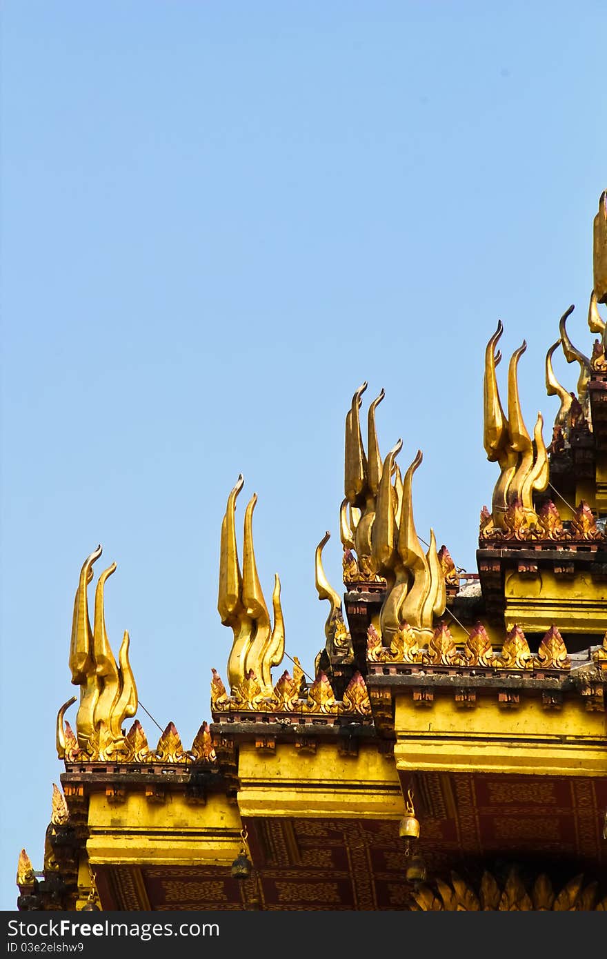 Art at temple roof with blue sky background. Art at temple roof with blue sky background