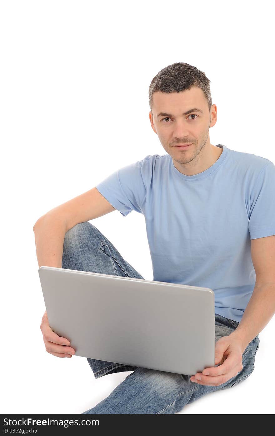 Young male working on laptop computer