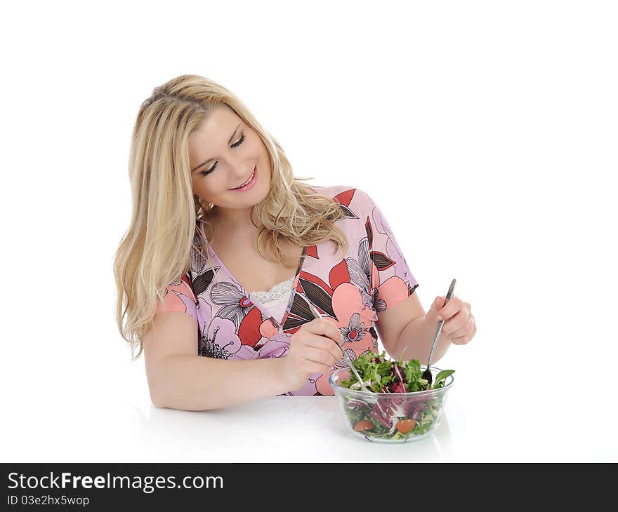 Casual woman eating healthy green vegetable salad