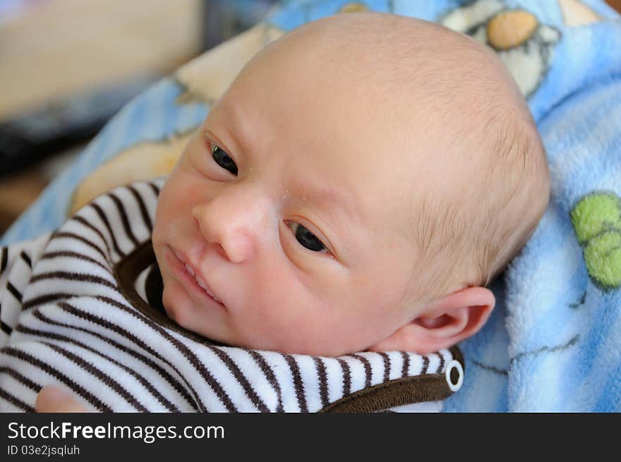 Young cute baby looking skeptical. Young cute baby looking skeptical.