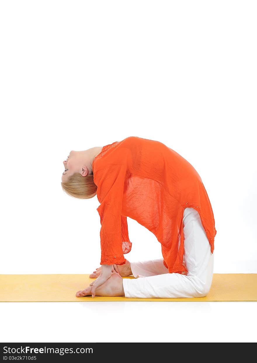 Series or yoga photos. young woman in camel pose on yellow pilates mat. Series or yoga photos. young woman in camel pose on yellow pilates mat