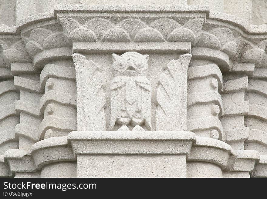 Owl cement and stone frieze