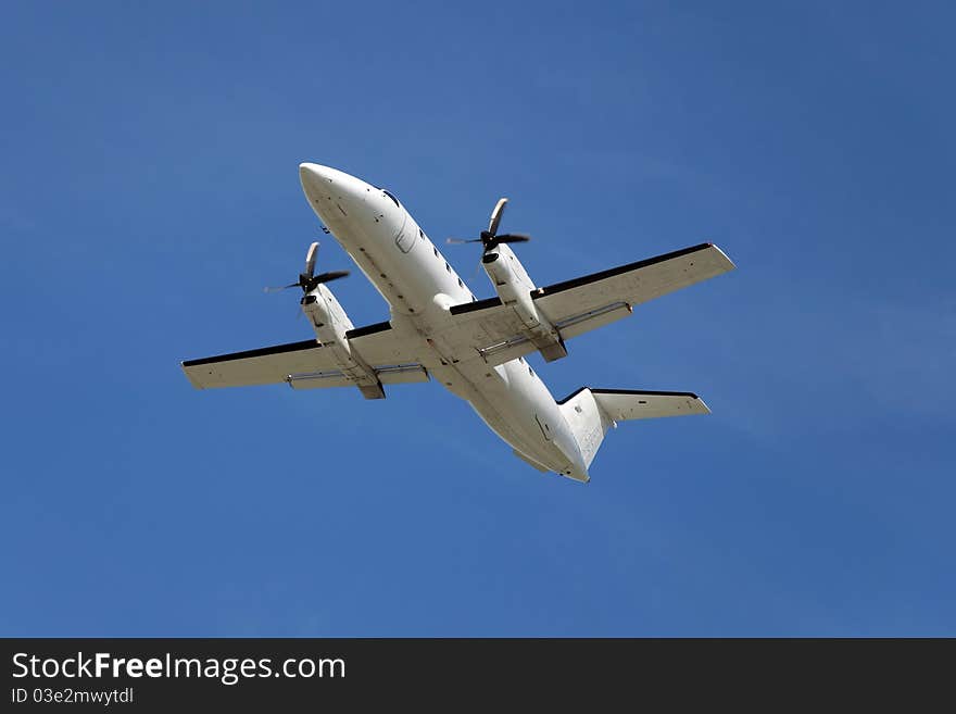 EMB-120 regional airliner during during climb after takeoff.