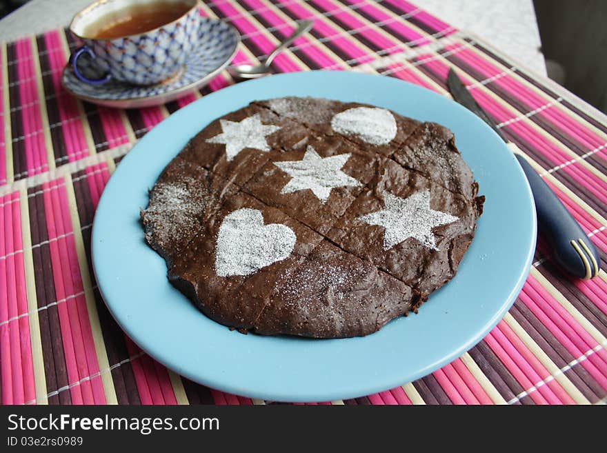 Selfmade chocolate cake and cup of tea. Selfmade chocolate cake and cup of tea