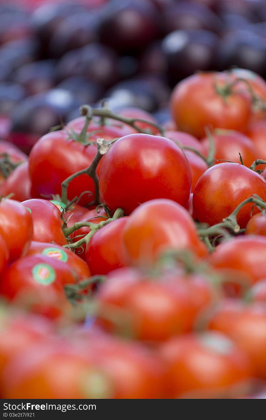 View in close up of some tomatoes on the street market's table.