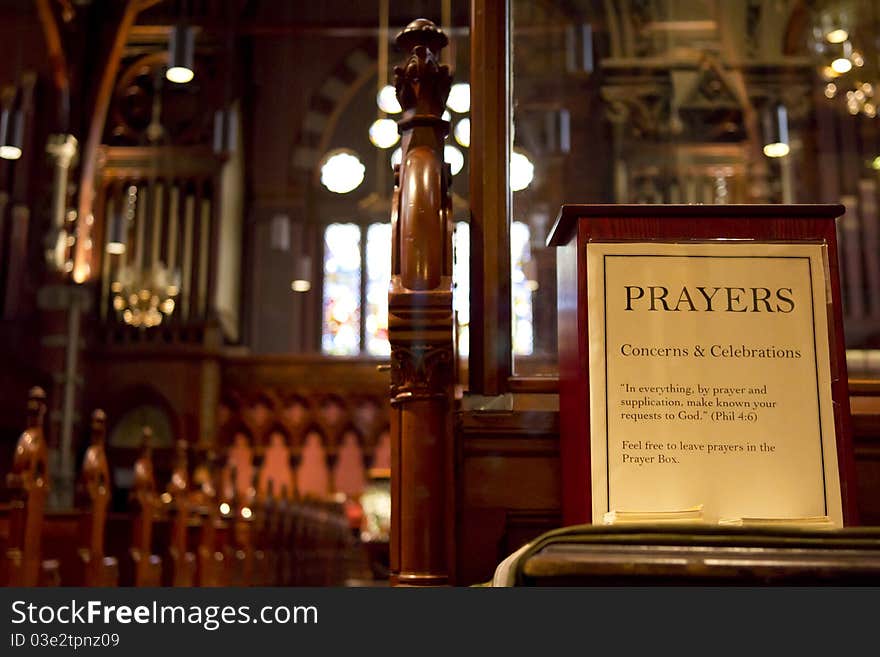 Interior view of a church with the focus on the drop box of prayers. Interior view of a church with the focus on the drop box of prayers.