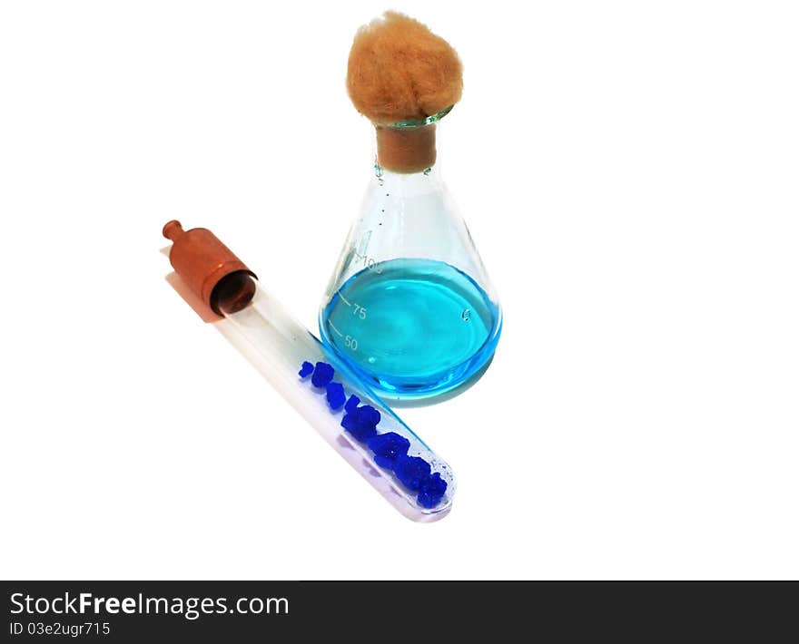 Flask with copper solution and tube with copper cristals isolated. Flask with copper solution and tube with copper cristals isolated