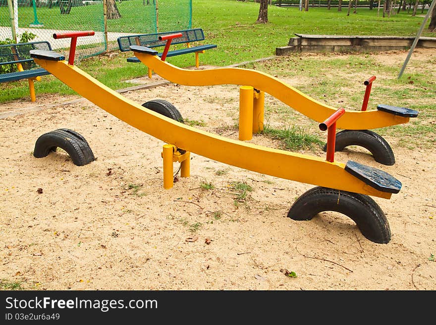 Yellow Seesaw in the Playground