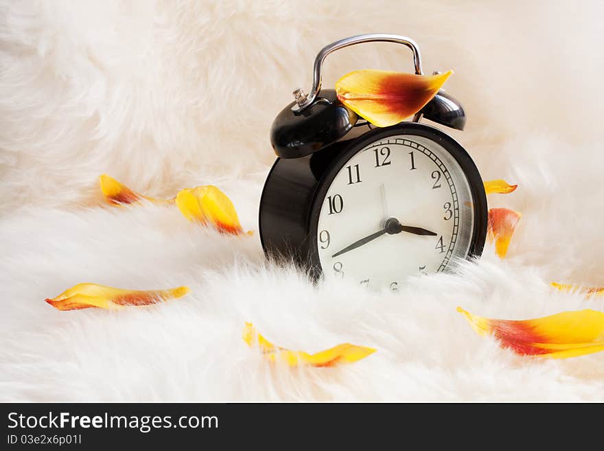 Vintage alarm clock on a warm rug