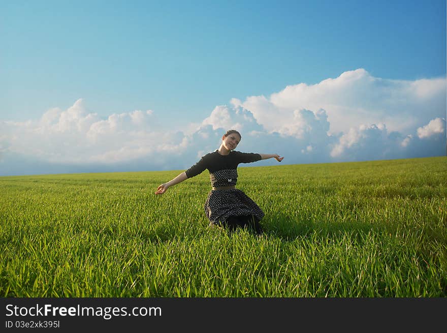 Girl on green field