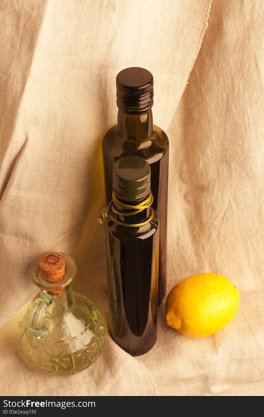 Still Life with olive oil retro bottles on canvas