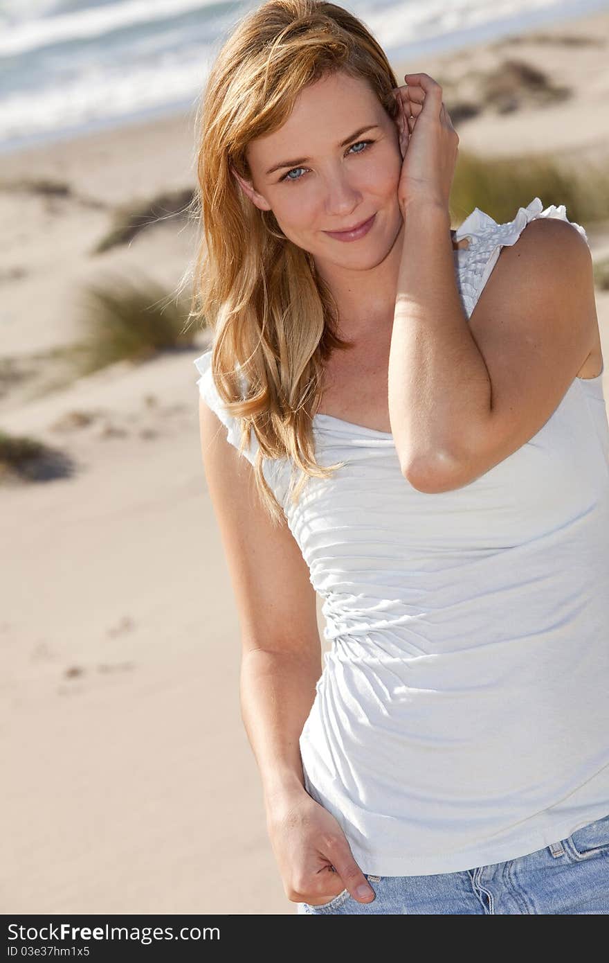 Young woman at the beach on a sunny day. Young woman at the beach on a sunny day