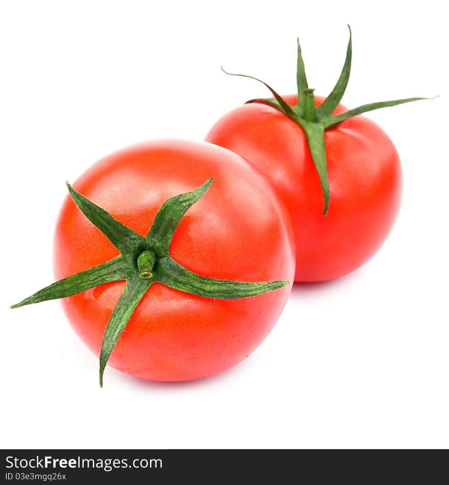 Two fresh red tomato isolated on white