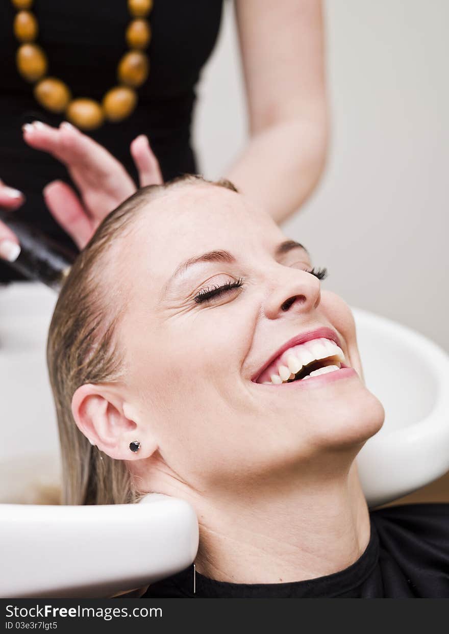 Laughing woman relaxing at the Beauty spa. Laughing woman relaxing at the Beauty spa