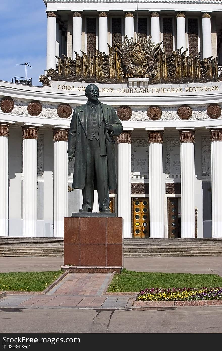 Sculpture on background of building House of Peoples of Russia, Moscow, Russia.