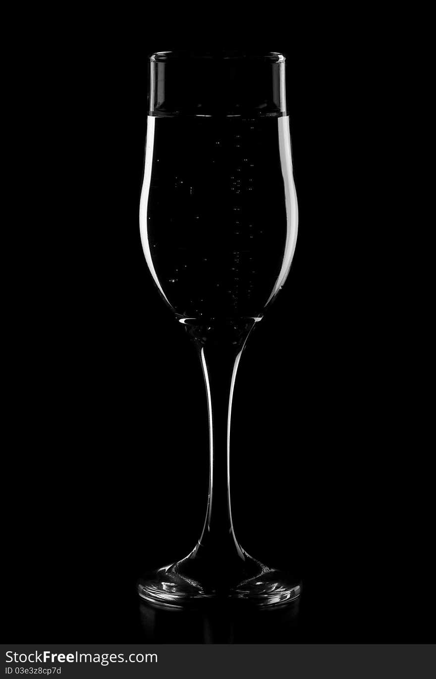 Glass for champagne isolated on a black background