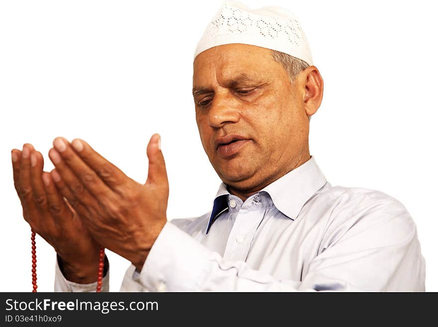 Hands with muslim prayer beads