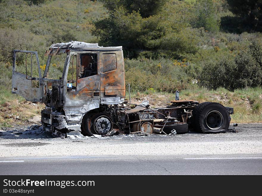 Truck burnt and abandonned along the road. Truck burnt and abandonned along the road