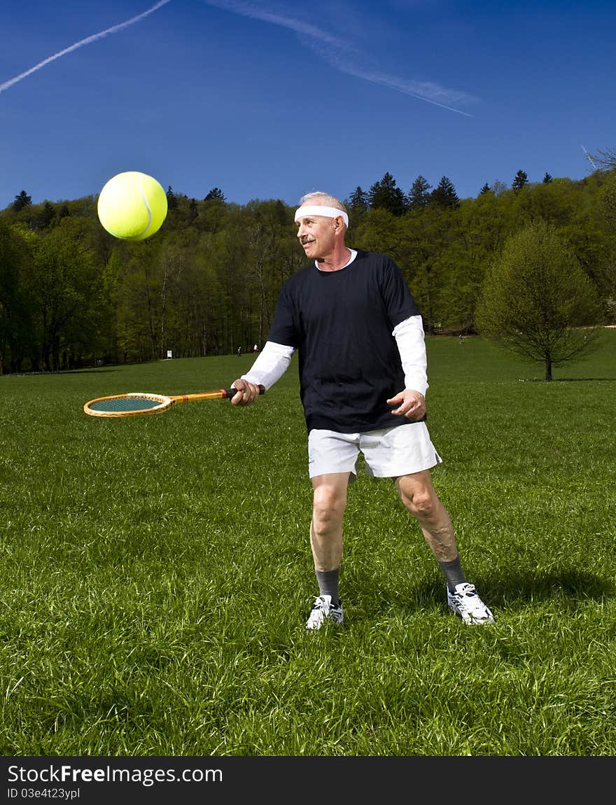 Senior Man Playing Tennis