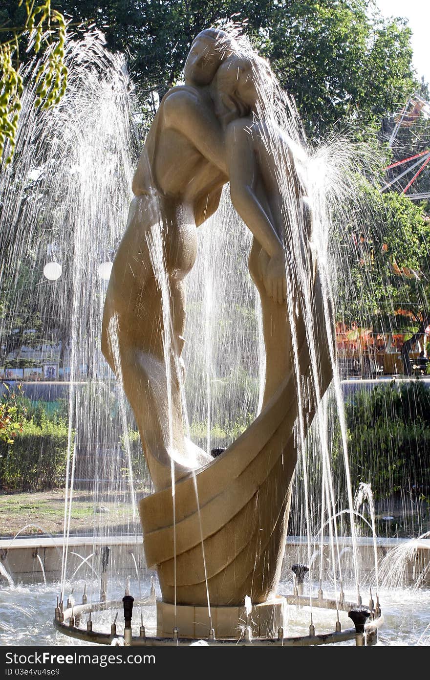 Sculpture loving couple in fountain. Feodosiya. City park. Sculpture loving couple in fountain. Feodosiya. City park