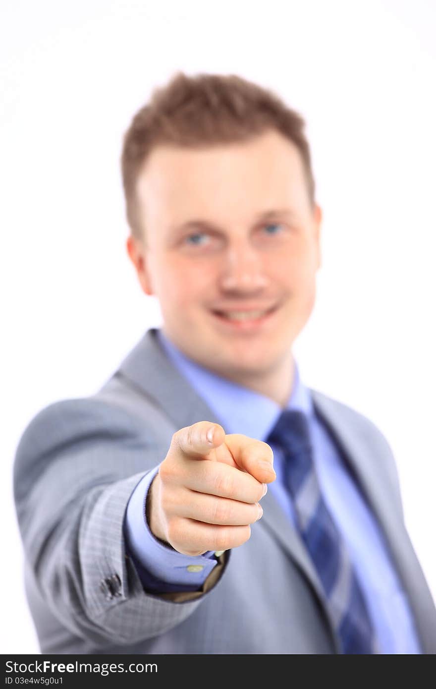 Full length of a handsome business man with hands folded against white background