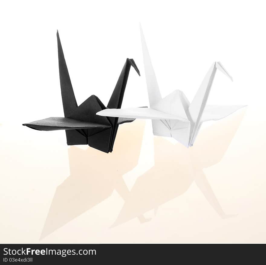 Black and white traditional Japanese origami crane bird isolated on white