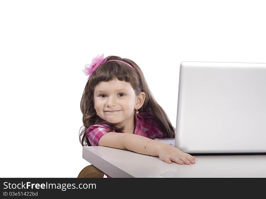 Little girl sitting at the computer. Little girl sitting at the computer