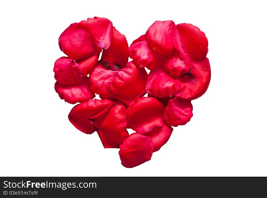 Red romantic heart made by rose petals