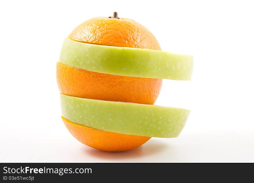 Apple and orange slices in one fruit. Apple and orange slices in one fruit