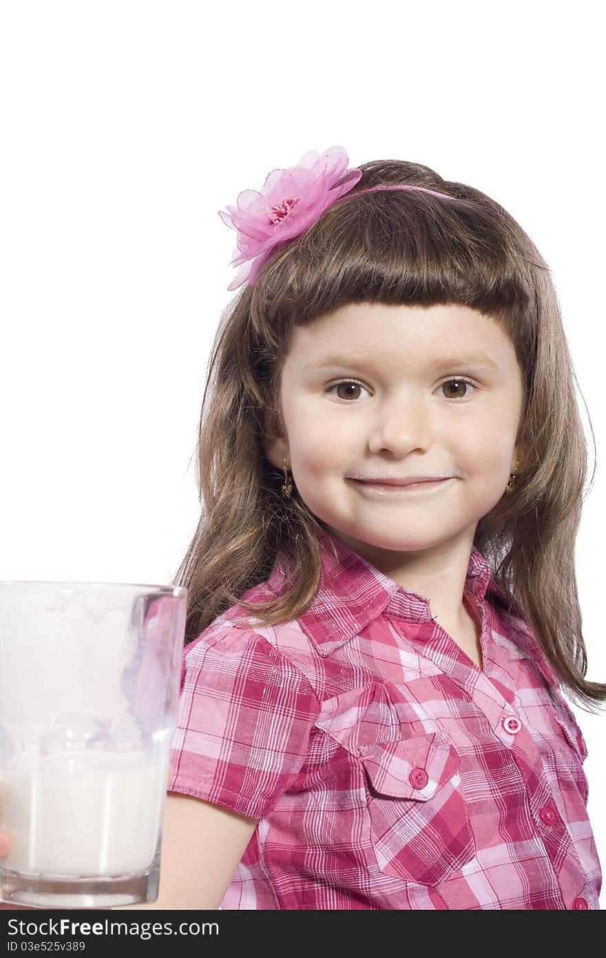 Little girl with a glass of healthy milk